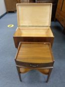 A mid 20th century walnut sewing trolley together with a further walnut side table fitted a drawer