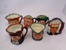 Six small Royal Doulton character jugs to include Old King Cole, North American Indian,