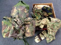 A large quantity of military items to include burgeon with sleeping bags, military clothing, globes,