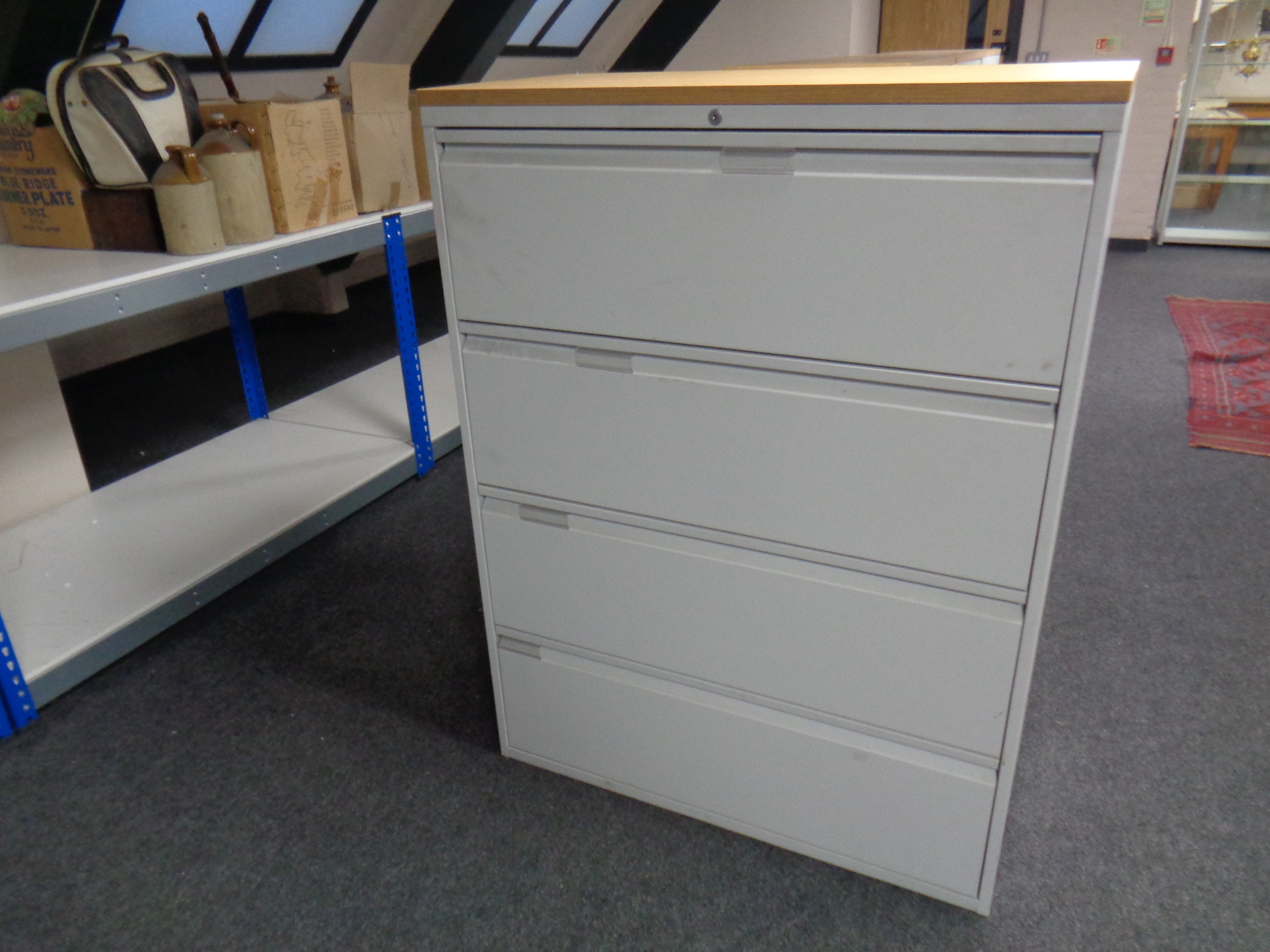 A four drawer metal document cabinet