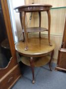 A mahogany two tier occasional table on cabriole legs together with a further two tier occasional