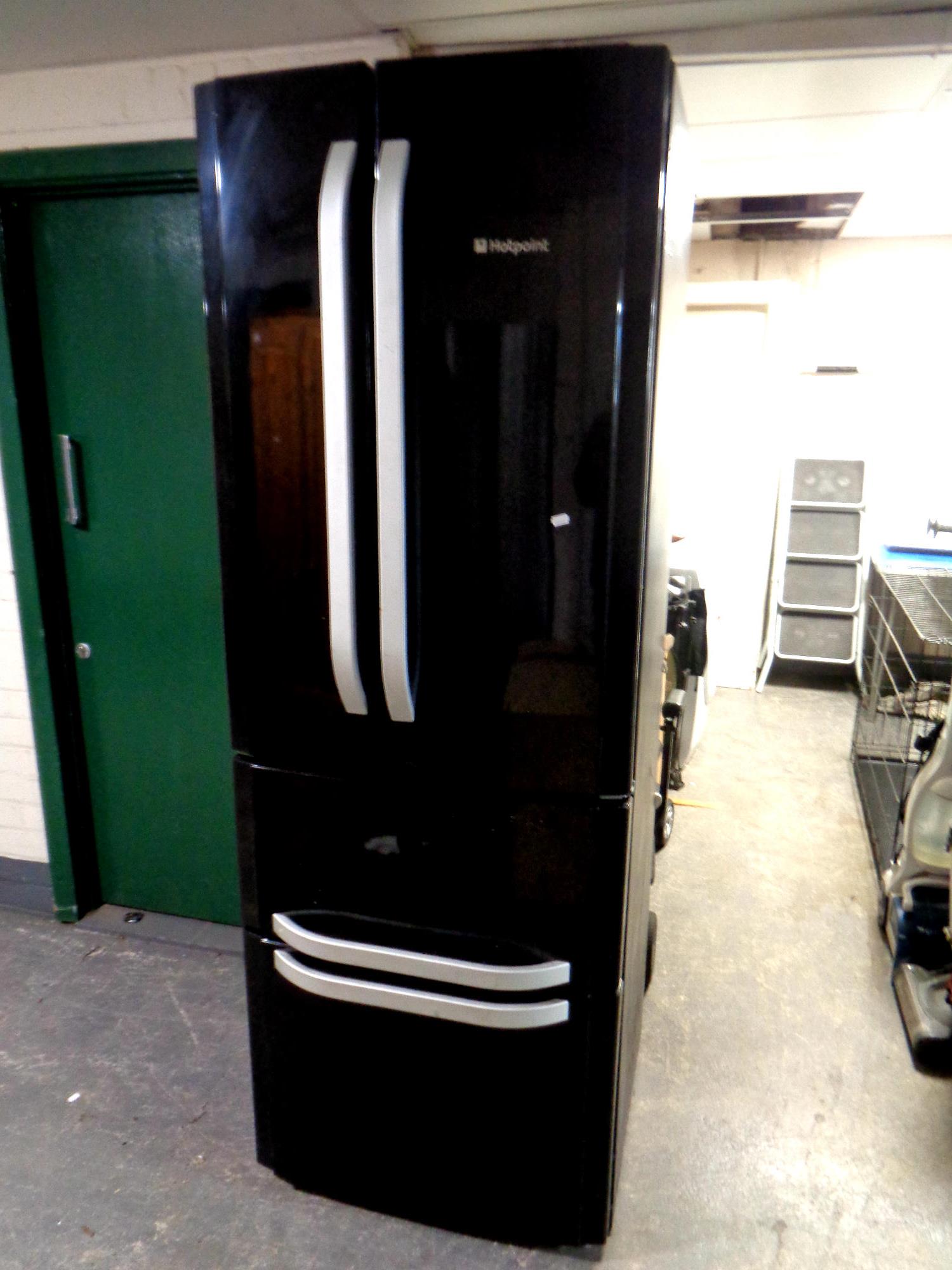 A Hotpoint American style fridge freezer, width 70 cm.