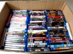 A box containing a large quantity of Blu Ray movies