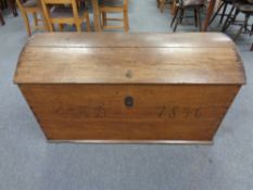 A 19th century oak dome topped shipping trunk,