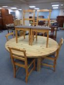A circular pine kitchen table, width 148 cm,