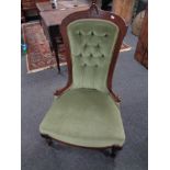 A 19th century mahogany framed lady's chair upholstered in a green button dralon