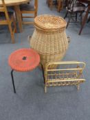 A wicker laundry basket with lid together with a bamboo and wicker magazine rack,