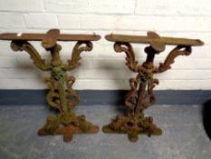 A pair of antique cast iron table pedestals