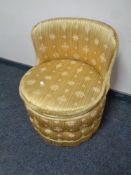 A mid 20th century bedroom chair upholstered in a gold striped fabric