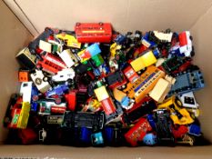 A box containing a large quantity of die cast delivery vans and buses by Matchbox, Corgi,