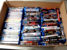 A box containing a large quantity of Blu Ray movies