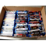 A box containing a large quantity of Blu Ray movies