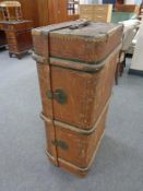 An antique bentwood bound shipping trunk