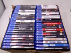 A box containing 46 Play Station 4 games to include God of War, UFC,