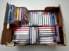 A box containing a large quantity of audio books and talking book cassettes