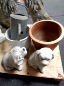 A pair of concrete garden figures, dogs, together with a ceramic plant pot and stand,