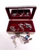 A metal jewellery box containing a quantity of silver jewellery to include pendant on chain,