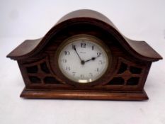 An early 20th century French carved oak cased eight day mantel clock