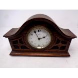 An early 20th century French carved oak cased eight day mantel clock