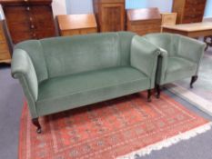 A 20th century settee and armchair upholstered in a green dralon on cabriole legs