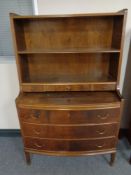 A mid 20th century continental walnut bow fronted bookshelves fitted drawers beneath, width 84.
