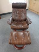A Stressless Ekormes swivel adjustable armchair and stool upholstered in a tan leather