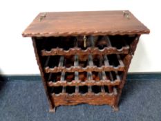 A rustic pine five section wine rack