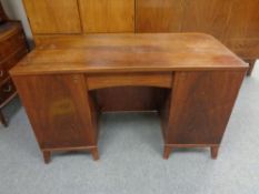 A mid 20th century continental twin pedestal writing desk,