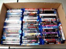 A box containing a large quantity of Blu Ray movies and box sets