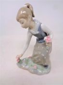 A Lladro figure, Girl picking flowers, No.