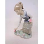 A Lladro figure, Girl picking flowers, No.