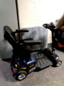 An Apex Rapid mobility cart with key and charger together with a plastic access ramp