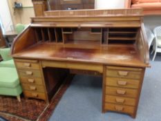 A continental mahogany twin pedestal roll top desk, width 164 cm,