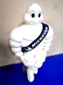 A plastic Michelin figure on metal mounting stand (official Michelin product)