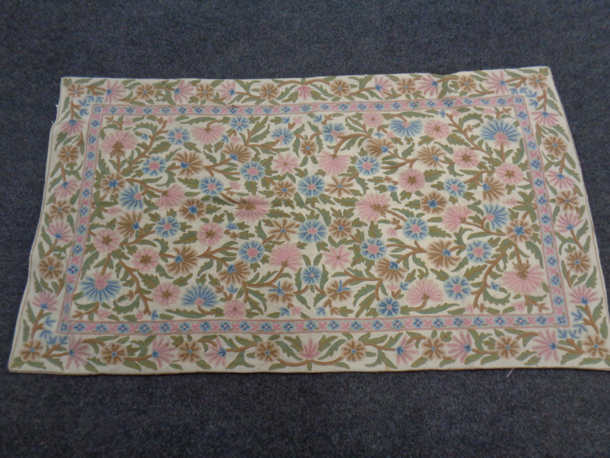 A Kashmiri chain stitch rug 155cm by 87cm