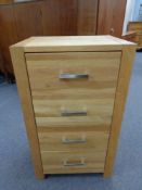 A contemporary oak four drawer chest,