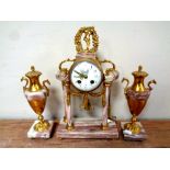 A three piece antique French decorative brass and marble clock garniture with pendulum and key