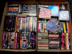 Four boxes containing a large quantity of assorted CDs and DVDs to include Club Land,