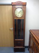 An early 20th century mahogany cased regulator clock with circular brass dial,