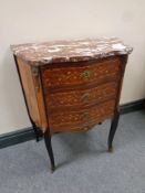 A French inlaid marble topped serpentine fronted three drawer chest on raised legs with brass