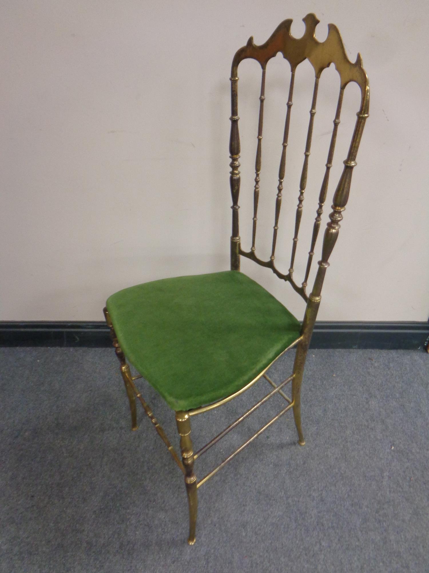 A brass bedroom chair