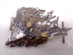 Approximately 67 antique pocket watch keys, 8 with jeweler's address,