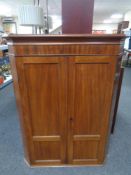 A 19th century mahogany double door hanging corner cabinet