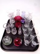 A tray containing assorted glassware to include glass paperweights,