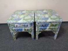 A pair of floral painted two drawer end tables with glass tops