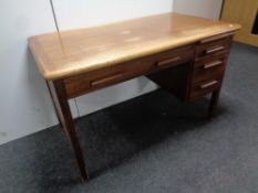 A 20th century single pedestal desk fitted four drawers