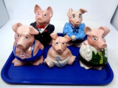 A tray containing five Wade Natwest pigs