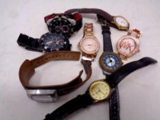 A bag containing a quantity of assorted lady's and gent's wristwatches to include Fossil, Pod,