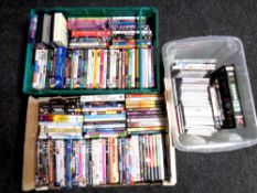 Three boxes containing assorted DVDs and CDs