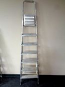 An aluminium seven tread folding stepladder